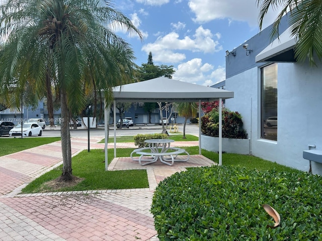 view of property's community featuring a patio and a gazebo