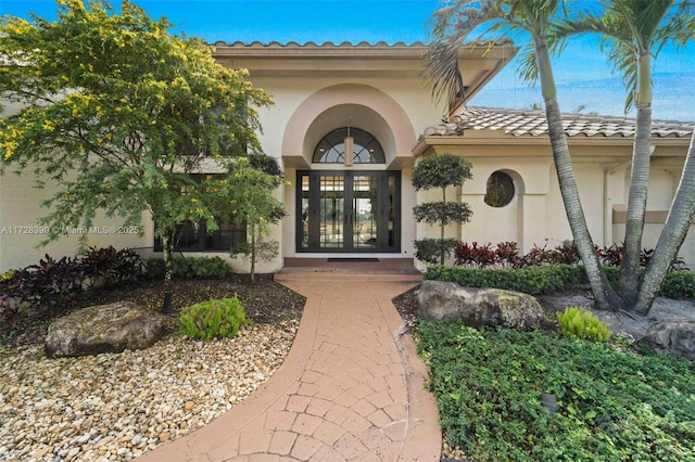 view of exterior entry featuring french doors