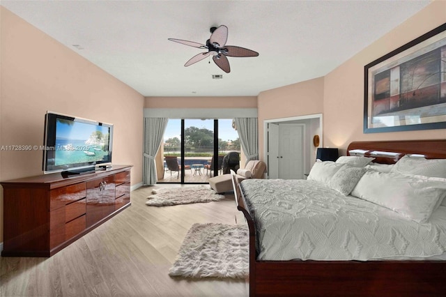 bedroom featuring ceiling fan, access to outside, and wood-type flooring