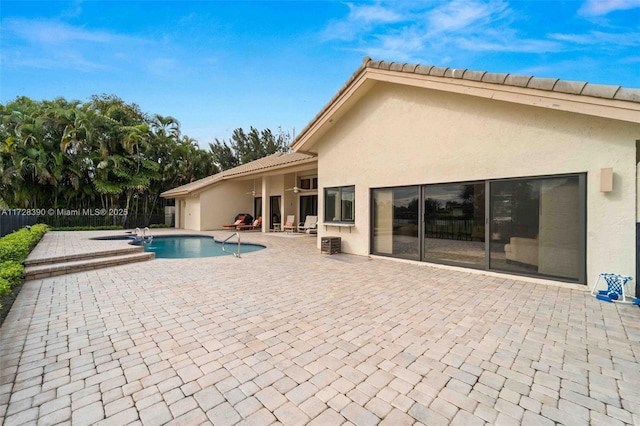 view of swimming pool featuring a patio area and cooling unit