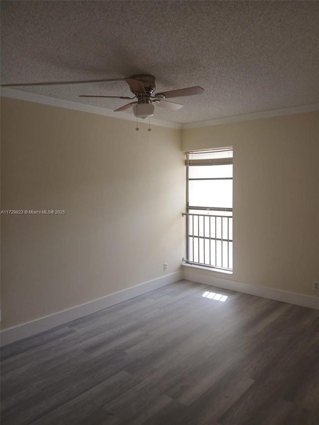 unfurnished room featuring ceiling fan, ornamental molding, dark hardwood / wood-style flooring, and a textured ceiling