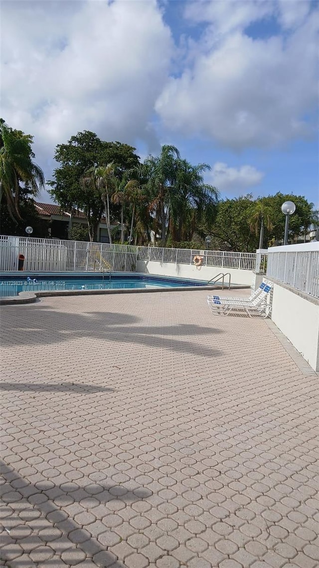 view of pool featuring a patio