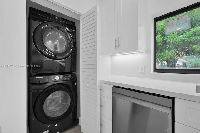 laundry room featuring stacked washing maching and dryer