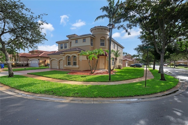 mediterranean / spanish-style house with a front yard