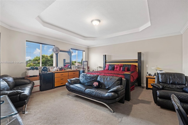 carpeted bedroom with crown molding, a raised ceiling, and a textured ceiling