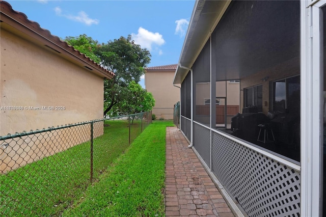 view of yard featuring a sunroom