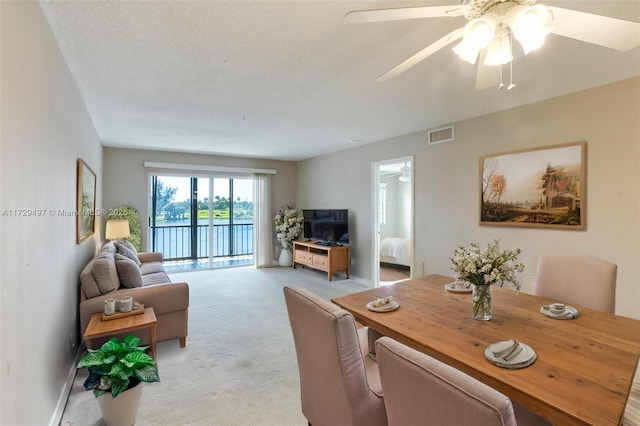 9400 N Hollybrook Lake Dr Unit 303, Pembroke Pines, FL 33025 - living area featuring visible vents, baseboards, light colored carpet, and ceiling fan
