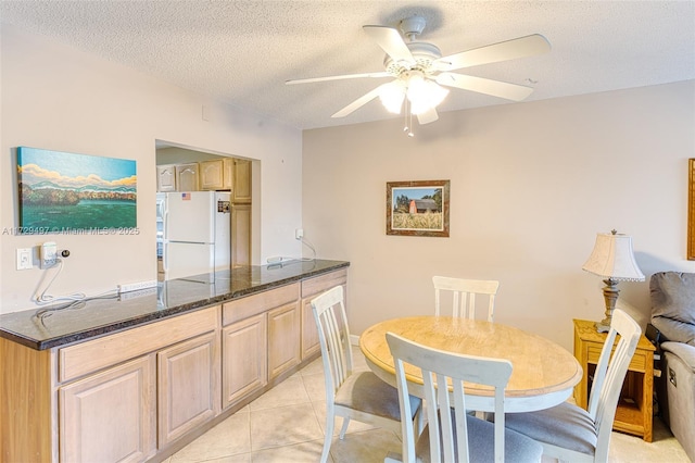 9400 N Hollybrook Lake Dr Unit 303, Pembroke Pines, FL 33025 - dining area with light tile patterned floors, a textured ceiling, and ceiling fan
