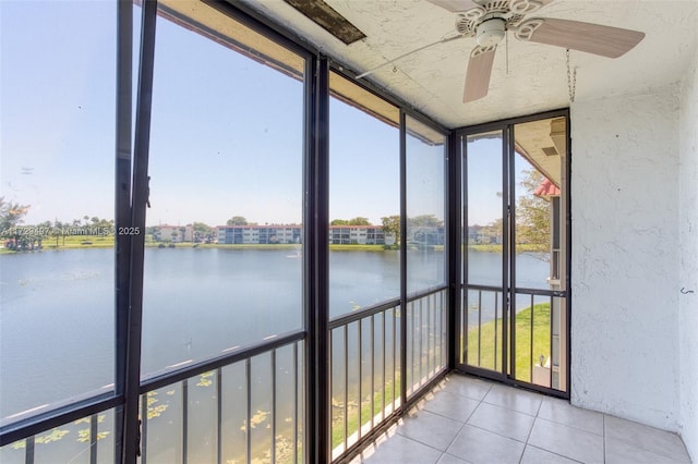 9400 N Hollybrook Lake Dr Unit 303, Pembroke Pines, FL 33025 - unfurnished sunroom featuring a water view, ceiling fan, and a healthy amount of sunlight