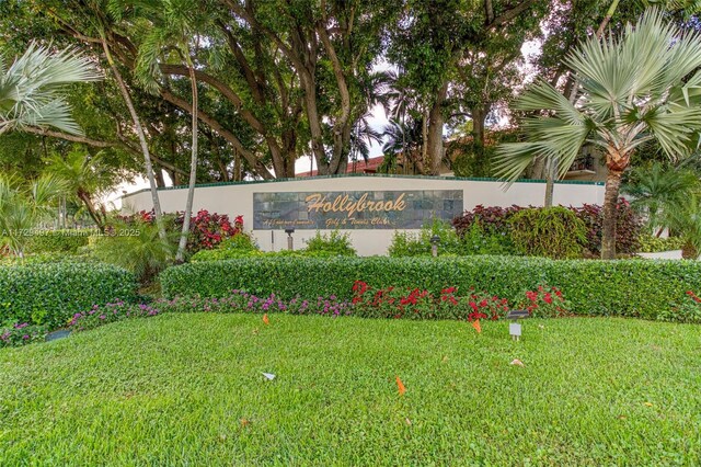 9400 N Hollybrook Lake Dr Unit 303, Pembroke Pines, FL 33025 - community sign with a lawn