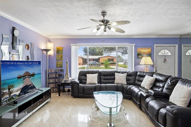 living room with ceiling fan, a textured ceiling, and ornamental molding