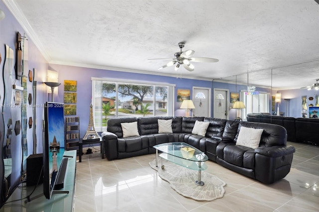 living room featuring ceiling fan, a textured ceiling, light tile patterned floors, and crown molding