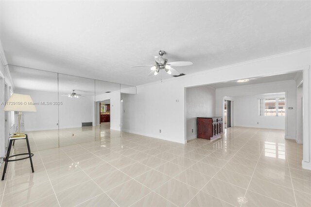 2070 NW 84th Ter, Pembroke Pines, FL 33024 - unfurnished living room with a ceiling fan, light tile patterned floors, ornamental molding, and baseboards