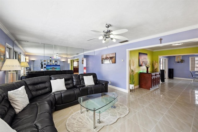 tiled living room with ceiling fan and ornamental molding