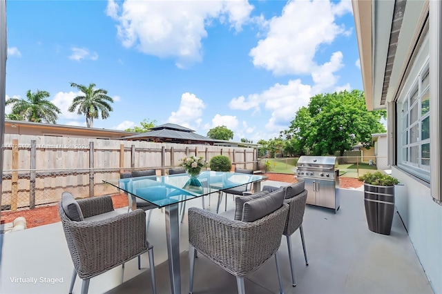 2070 NW 84th Ter, Pembroke Pines, FL 33024 - fenced backyard with outdoor dining space, a patio, and area for grilling