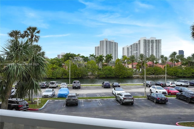 uncovered parking lot with a water view