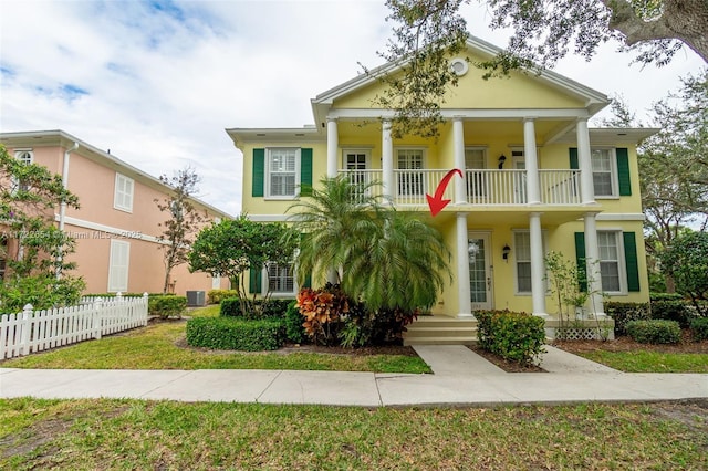 greek revival house with a balcony and central AC