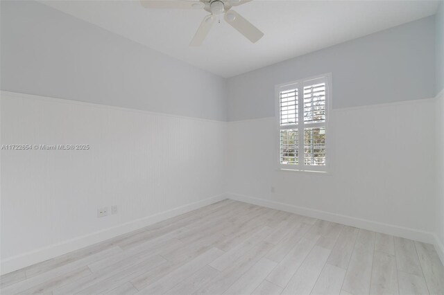 spare room featuring ceiling fan and light wood-type flooring