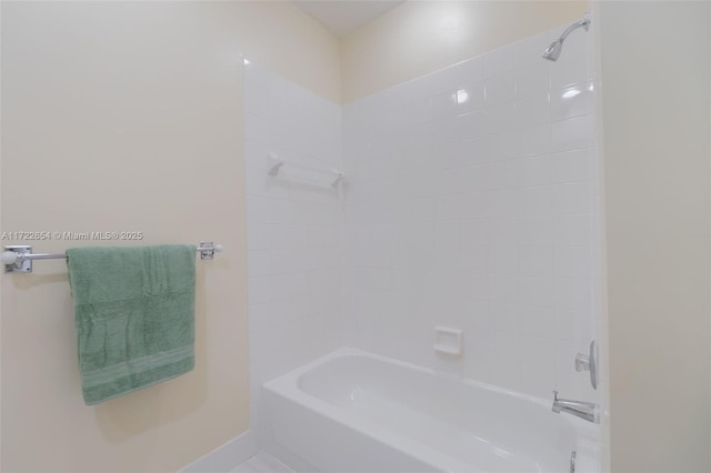 bathroom with bathing tub / shower combination