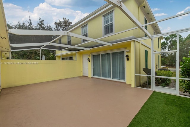 back of house with a patio area