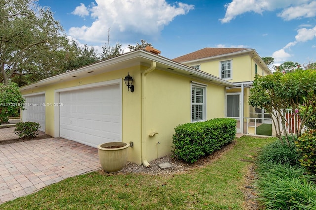 view of side of property with a garage