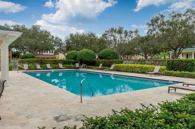 view of swimming pool with a patio area