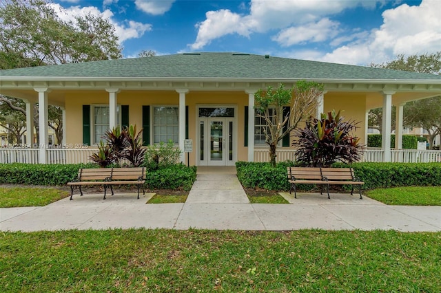 exterior space with a front yard and a porch