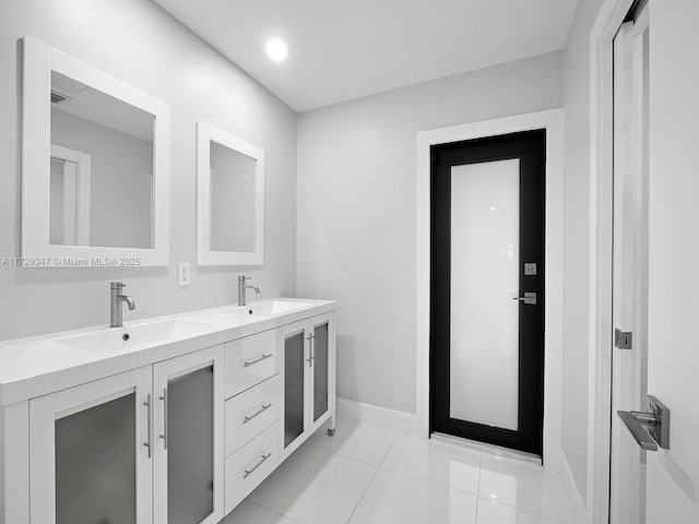 bathroom with tile patterned floors and vanity