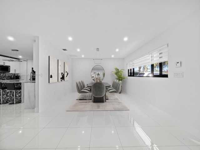 tiled dining space with sink