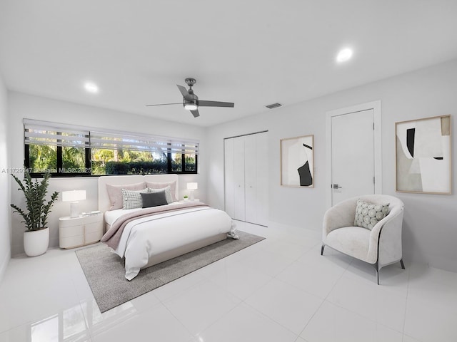 tiled bedroom with ceiling fan