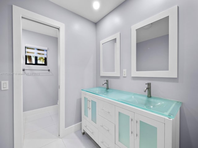 bathroom with vanity and tile patterned flooring