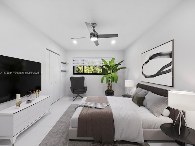 bedroom featuring ceiling fan and light tile patterned floors