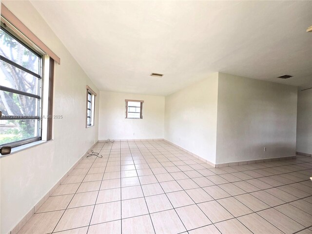 7200 NW 4th St, Miami, FL 33126 - spare room with light tile patterned floors and baseboards