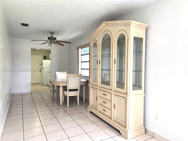 7200 NW 4th St, Miami, FL 33126 - dining space featuring ceiling fan, light tile patterned floors, and baseboards