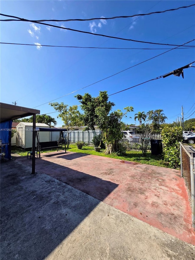 view of patio with a storage unit