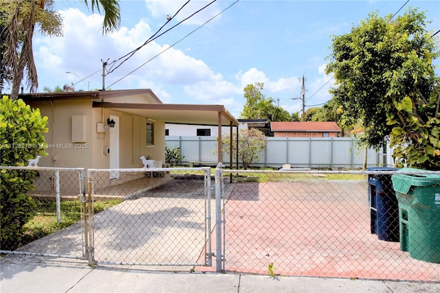 7200 NW 4th St, Miami, FL 33126 - view of front of property with an attached carport and a gate