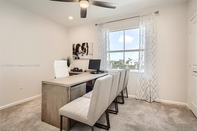 home office with ceiling fan and light colored carpet