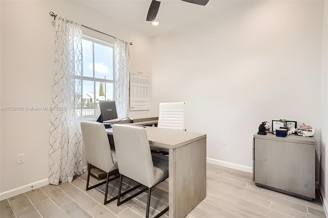 office space with light wood-type flooring and ceiling fan