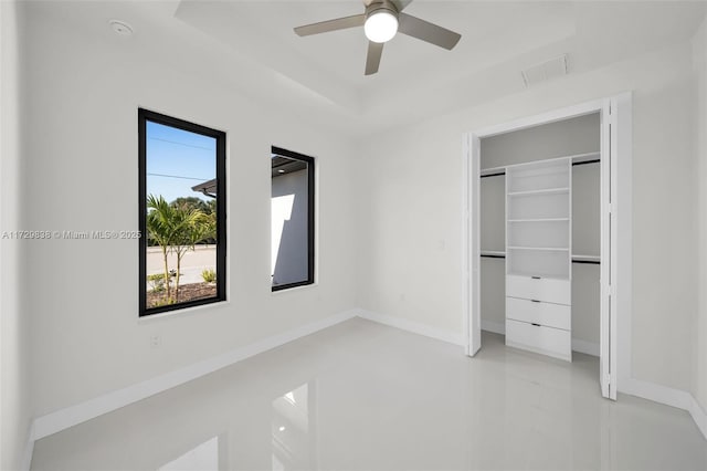 unfurnished bedroom with a closet and ceiling fan