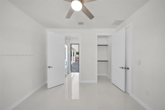 unfurnished bedroom featuring ceiling fan