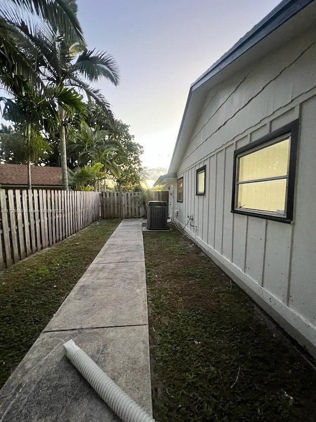 yard at dusk with cooling unit