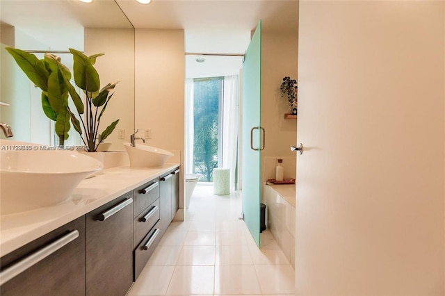 bathroom with vanity and tile patterned flooring