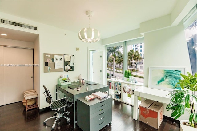 home office with dark wood-type flooring