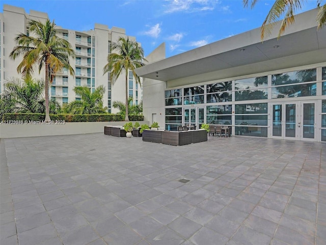 exterior space with outdoor lounge area and french doors