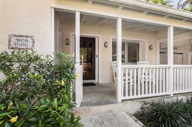 entrance to property featuring a porch