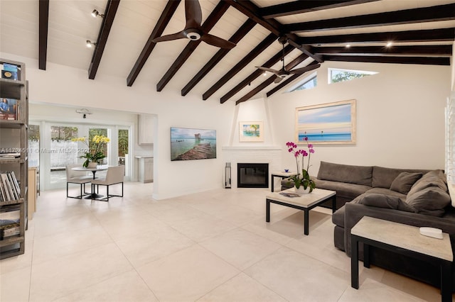 tiled living room featuring a large fireplace, ceiling fan, high vaulted ceiling, and beam ceiling