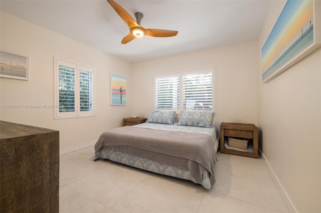 bedroom featuring ceiling fan and light tile patterned flooring