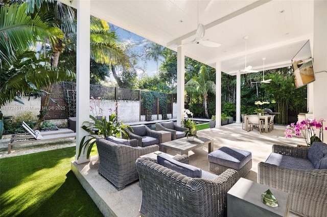 view of patio with ceiling fan and outdoor lounge area