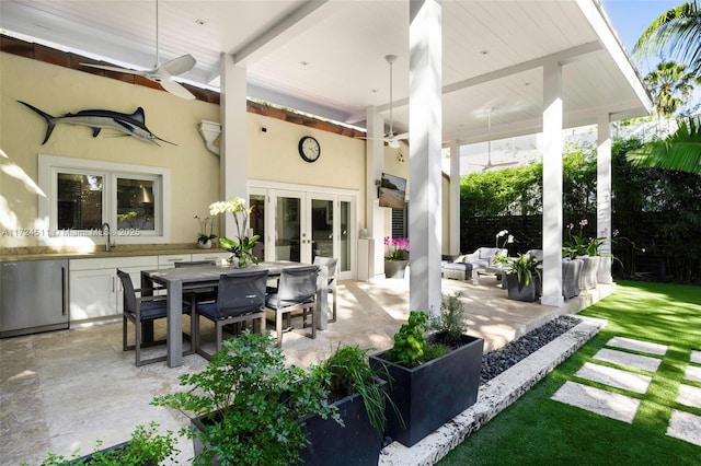 view of patio / terrace with sink, french doors, and outdoor lounge area