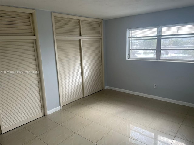 unfurnished bedroom with a closet